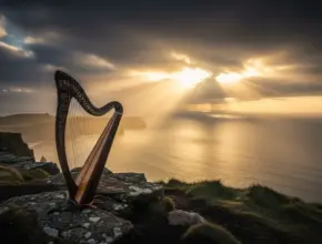 book of proverbs bible outline. A harp sitting on a cliff overlooking a sunrise over the ocean.